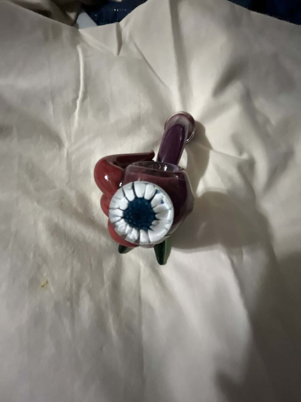 Artistic Glass Hand Piece with Eye Detail and Green Leaf Accent